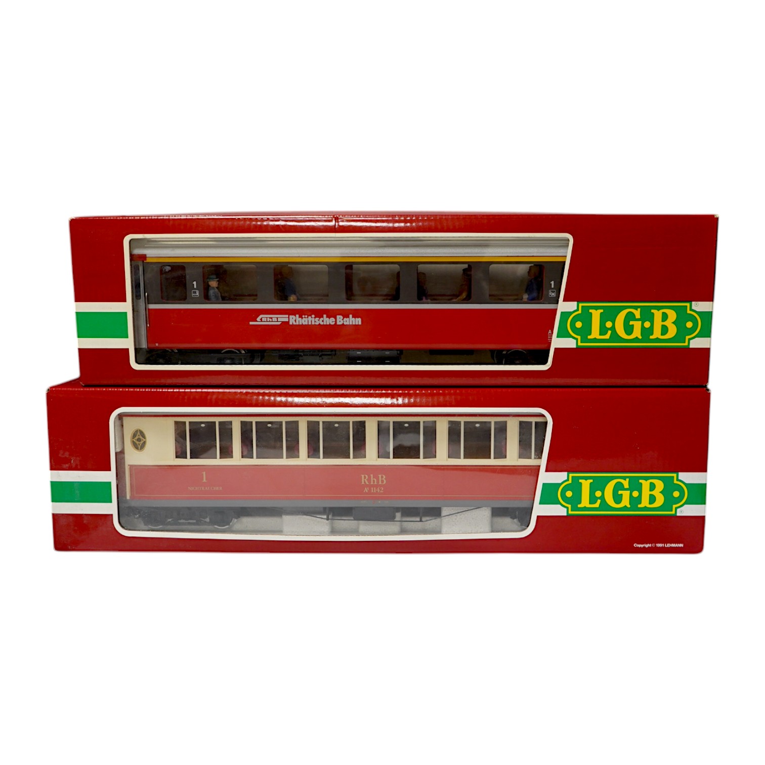 Three boxed LGB G scale Continental outline RhB bogie coaches; a Full First (30650), a restaurant car (3068), and another Full First (3067). Condition - good.